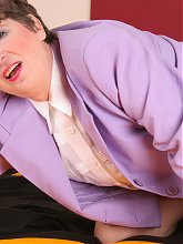 This classy housewife plays with her pussy
